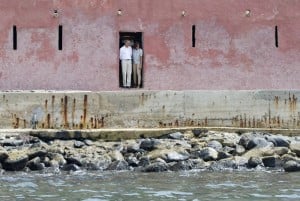 US President Barack Obama  and First Lady Michelle Obama look out from the "Door of No Return" while touring the House of Slaves, or Maison des Esclaves, at Goree Island off the coast of Dakar on June 27, 2013.  Photo: AFP/Saul Loeb