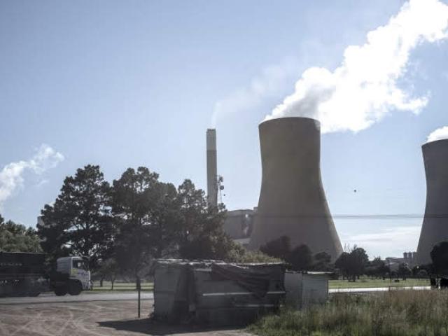 This February 2015 picture shows the entrance to Eskom's Duvha Power Station in the Witbank (Emalahleni) region of South Africa. Air pollution in coal-rich Mpumalanga Province is a national concern. Photo: AFP/MARCO LONGARI