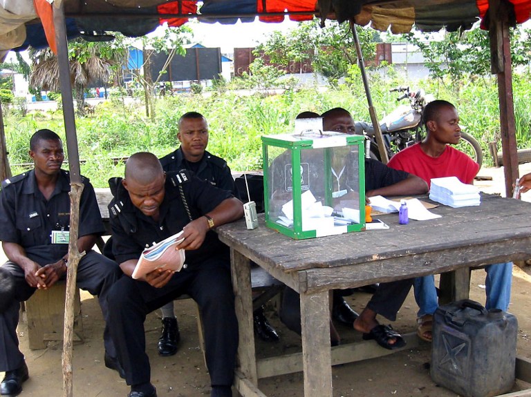 Security officials keep watch at a voting centres at Abonnema Wharf in Port-Harcourt state on 3 May 2003. There were protests after a gubernatorial election held in the state was allegedly rigged in favour of the incumbent governor. Photo: AFP/Pius Utomi Ekpei