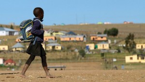 A child walks to school in June 2013 in a village outside the town of Mthatha in South Africa's Eastern Cape province. Photo: AFP/Jennifer Bruce