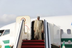 Nigeria's President Muhammadu Buhari arrives at the airport in Abuja after health checks in a London hospital, on 19 June 2016. He has also been treated in 2017. Photo: AFP/ Sunday Aghaeze