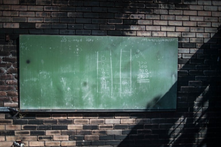 A blackboard at the Kurulen Primary school in Vuwani, Limpopo, on the day the school reopened in August 2016 following an arson attack. Photo: AFP/MUJAHID SAFODIEN