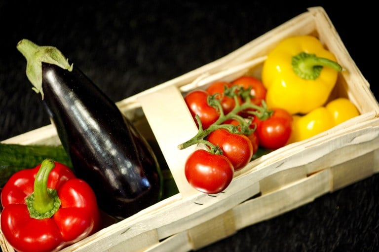 A basket containing peppers, tomatoes and aubergine. Photo: AFP/Odd Andersen