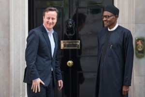 Britain's Prime Minister David Cameron speaking in May 2015 to Nigerian President Muhammadu Buhari. Photo: AFP/Leon Neal