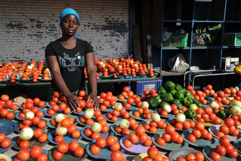 A vendor sells vegetables at the Alexandra township, near Johannesburg, in 2010. Photo: AFP/Monirul Bhuiyan