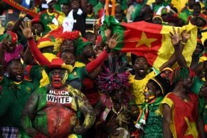 Cameroon supporters cheer ahead of the 2017 Africa Cup of Nations group A football match between Cameroon and Gabon at the Stade de l'Amitie Sino-Gabonaise in Libreville on January 22, 2017. Photo: AFP / GABRIEL BOUYS