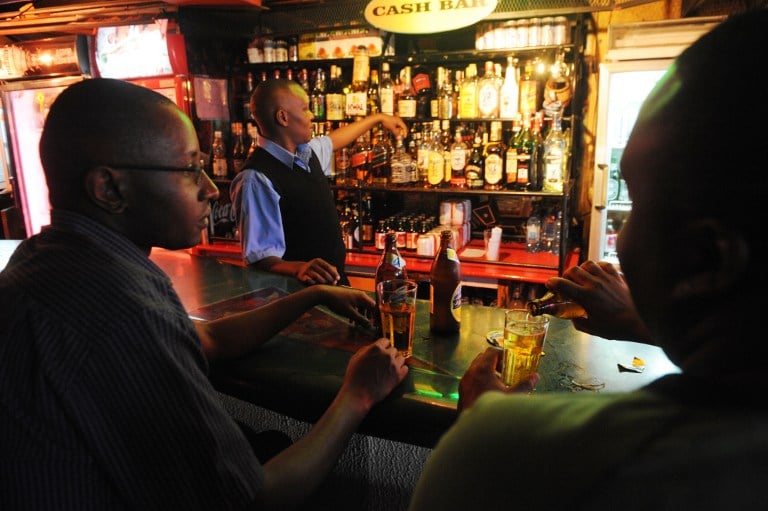 A customer at a Pretoria bar does a hand-stand during the 2010 Soccer World Cup. Photo: AFP/Yasuyoshi Chiba