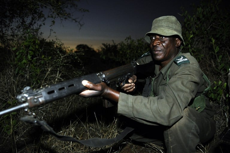 A SANParks ranger takes part in a night patrol exercise in the Kruger National Park. Photo: AFP/Stephane de Sakutin