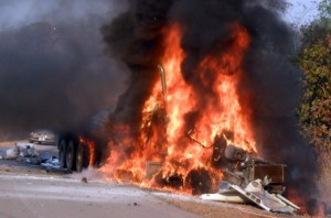 A truck burns after colliding with a bus in Zambia. More than 30 people died in the June 2011 accident. Photo: AFP/Dennis Milanzi