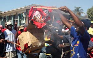 Protesters set alight a cloth printed with the face of Swaziland's King Mswati III during a pro-democracy demonstration held in Manzini on September 6, 2011. Photo: AFP/Jinty Jackson 