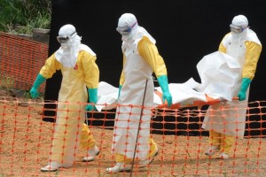 Staff from Medecin sans Frontieres prepare to bury an Ebola victim in Guekedou, Guinea on April 1, 2014. Photo: AFP/Seyllou