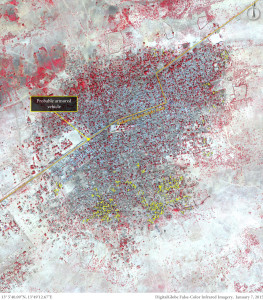 A satellite image taken on 7 January 2015 and obtained by Amnesty International shows the town of Baga after the Boko Haram attack. Vehicle activity is present along the main road, including a probably armoured vehicle stationed at a road block close to the centre of town. The yellow dots represent damaged or destroyed strutures. Photo: Amnesty International