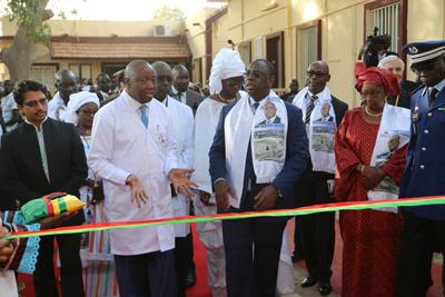 Prof Serigne Abdou Ba (in white coat) is seen here with Senegal president Macky Sall during the opening of the cardiology ward of the Aristide Le Dantec hospital on 20 January, 2015. Photo: SFC.
