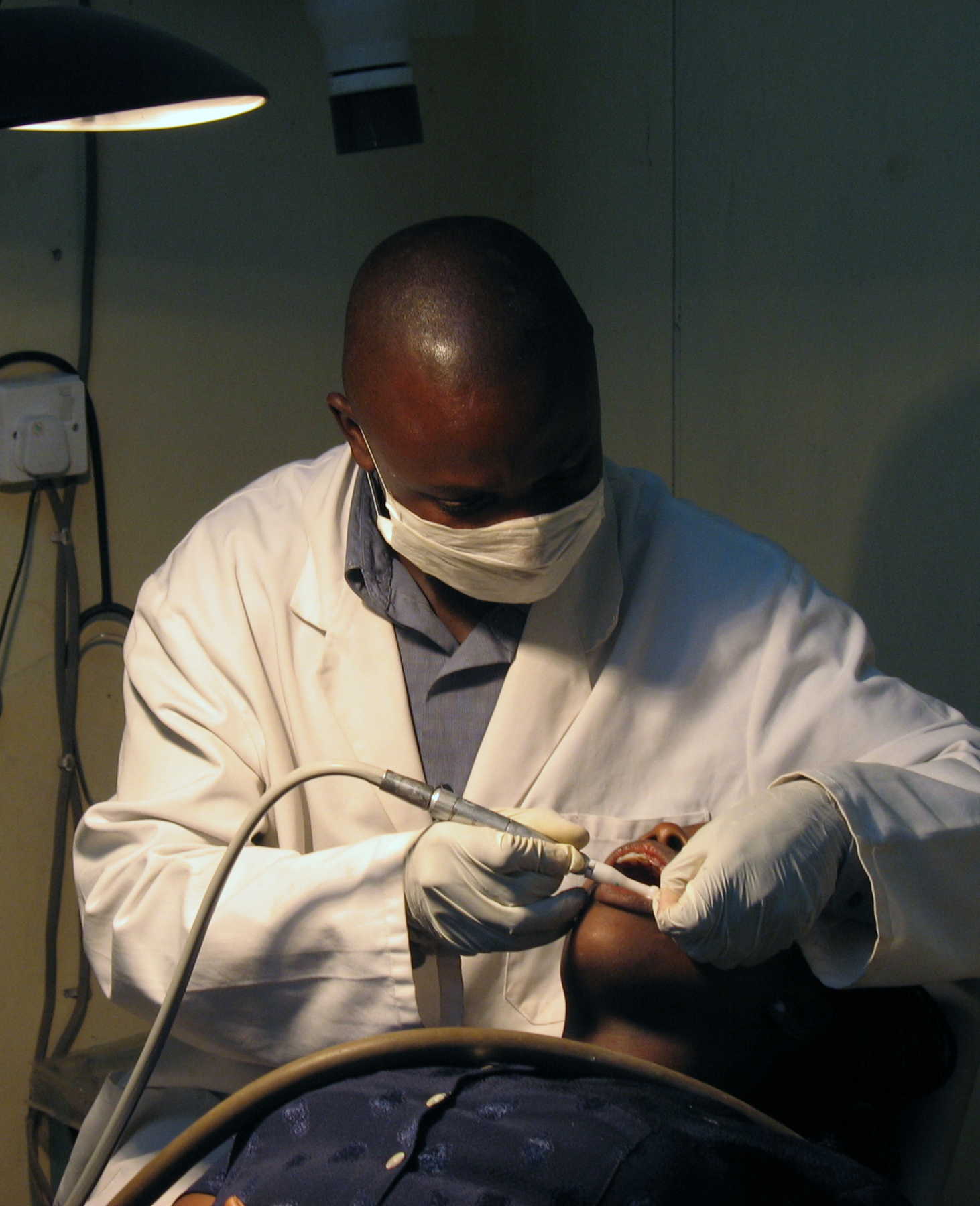 A dental assistant at work in the ECWA Evangel Hospital in Jos, Nigeria, in May 2006. Photo: Mike Blyth