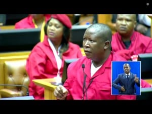 EFF leader Julius Malema shortly before he was physically removed from Parliament by unidentified 'security forces'. 