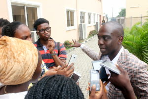 David Ajikobi being interviewed by students who attended a symposium held at the University of Lagos in July 2017.