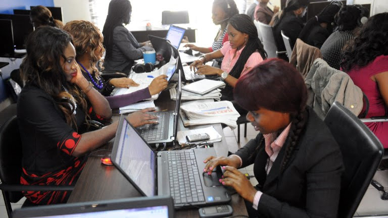 Customer care department employees of the Nigerian job-finder site Jobberman at work in June 2013 in the upmarket Lagos suburb of Lekki. The site was set up by university student Ayodeji Adewunmi to address the country's huge youth unemployment problem. Photo: AFP/ PIUS UTOMI