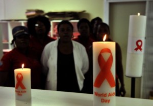 Staff at the Themba Lethu Clinic in Johannesburg, the largest antiretroviral treatment site in the country, posing with candles to mark World Aids Day 2013. Photo: AFP/Alexander Joe
