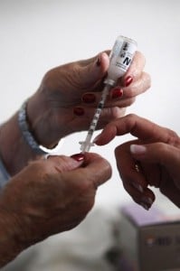 A nurse shows a diabetic patient how to draw an insulin injection. Photo: AFP/Getty Images
