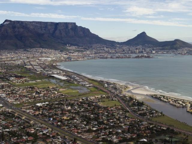 An aerial photo taken on June 30, 2013 shows Table Mountain and central Cape Town, in South Africa. Photo: AFP/ Saul Loeb