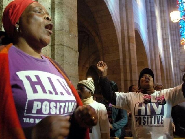 Members of the Treatment Action Campaign hold a prayer service in this August 2006 file photograph. At the time the TAC had begun a civil disobedience campaign over the Mbeki government’s AIDs policies and were calling for then health minister Mant