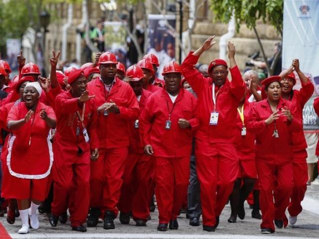 Members of the Economic Freedom Fighters party (EFF) arrive on the red carpet before the formal opening of parliament in Cape Town in February 2015. PHOTO: AFP/NIC BOTHMA
