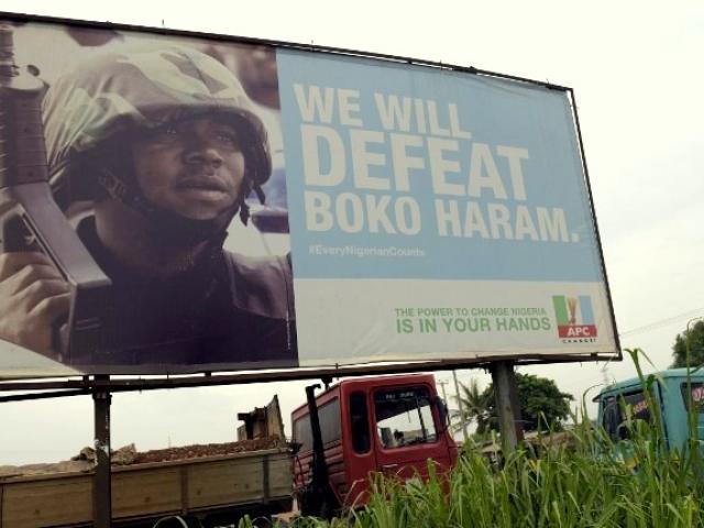 A billboard erected by Nigeria's governing All Progressives Congress (APC) promises to defeat Boko Haram. Photo: AFP/Pius Utomi Ekpei