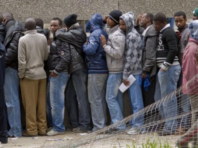 Men standing in queue 