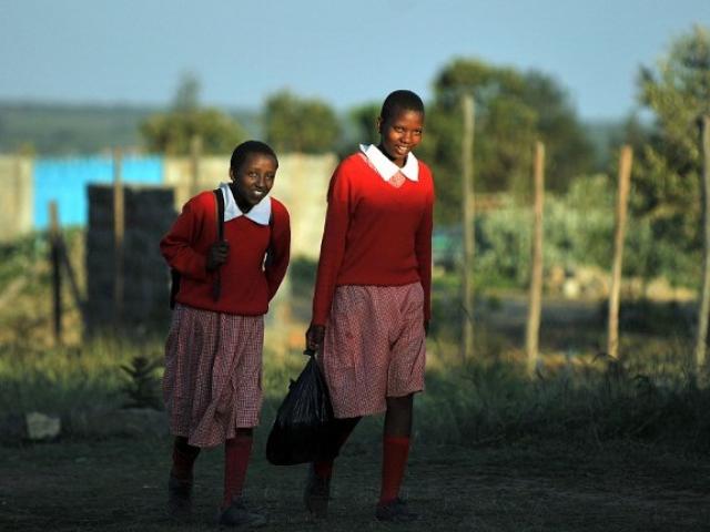 Two young Maasai girls arrive back from school in September 2011. Photo: AFP/Tony Karumba