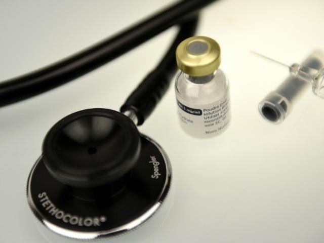 This March 2016 picture shows a solution for the treatment of severe hypoglycemia that may occur in diabetes and a stethoscope for display. Photo: AFP/Franck Fife
