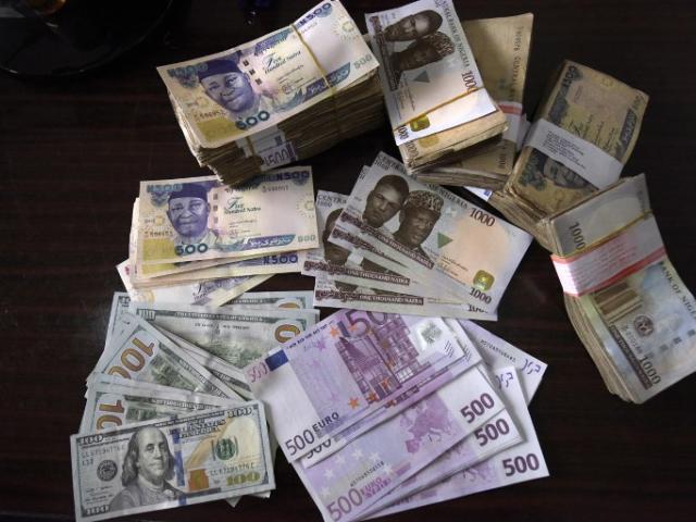 Bank notes in naira, dollars, euros and pounds are pictured in Lagos in January 2016. Photo: AFP/PIUS UTOMI EKPEI