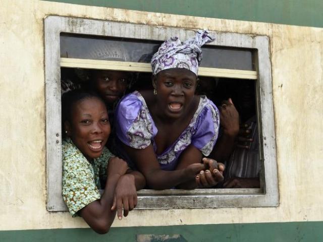 Passenger look out of the windows of a train at the Ebute-Metta headquarters of the Nigerian Railway Corporation in Lagos in March 7, 2017. Nigeria's acting President Yemi Osinbajo has signed off on the construction of the Lagos-Ibadan double track r