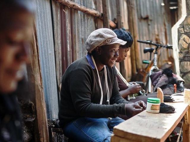Women work in Nairobi's Korogocho slum creating clothes and accessories for Ethical Fashion Africa, a not-for-profit group, on June 19, 2014. Ethical Fashion Africa is part of Ethical Fashion Initiative (EFI), a project built on a model of "mutual be