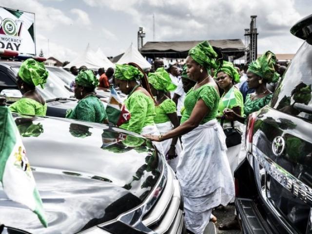 Nigerian women taking part in a Democracy Day parade in Owerri on 29 May 2017. Photo: AFP/MARCO LONGARI
