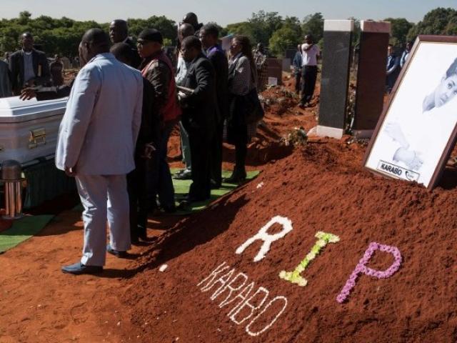 Friends and relatives of South African woman Karabo Mokoena (22) attend her burial in Johannesburg on 19 May. She was murdered, allegedly by her former lover. Photo: AFP/DAYLIN PAUL