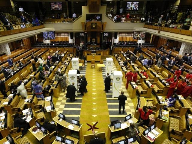 Parliamentary officials prepare the chamber for voting prior to an unsuccessful motion of no confidence in President Jacob Zuma in August 2017. Photo: AFP/MARK WESSELS