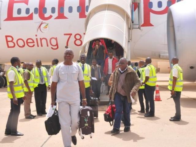 Passengers disembark from their plane upon arriving from Addis Ababa, at Kaduna's airport, on 8 March 2017 after Nigeria's capital was cut off by air following the closure of Abuja airport for repairs. This forced flights to divert and lengthened tra
