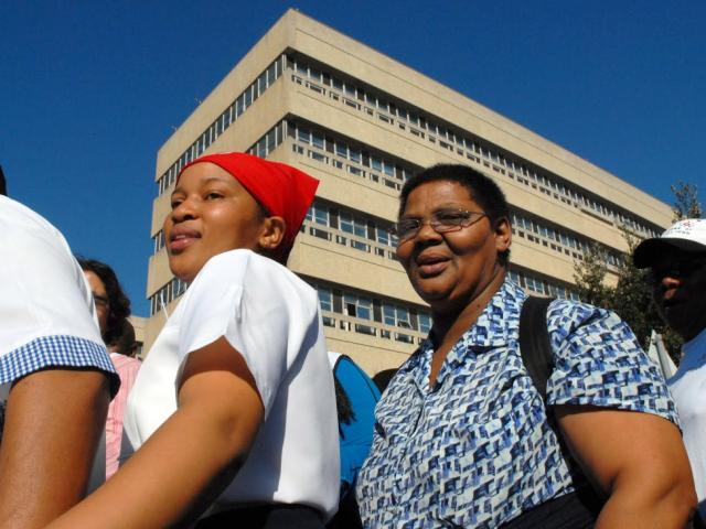 South African public service workers in June 2007 picketed for higher pay, including these employees of Groote Schuur hospital. Studies on income have consistently found a gender wage gap in the country. Photo: AFP/RODGER BOSCH