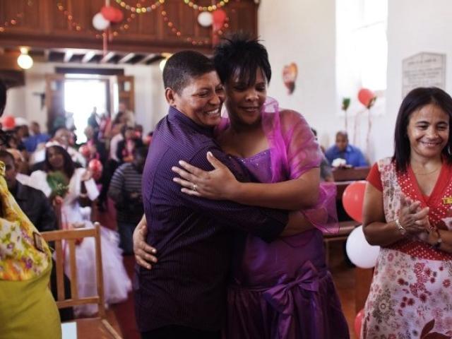 South African same-sex couple Sonia Souls and Charmaine Weber embrace after getting married in the Robben Island chapel on 14 February 2010. Photo: AFP/GIANLUIGI GUERCIA