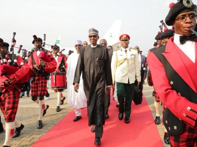 Nigerian President Mohammadu Buhari walks to the presidential lounge in Abuja on his return to the country in August 2017 after a medical leave of absence. Photo: AFP/SUNDAY AGHAEZE