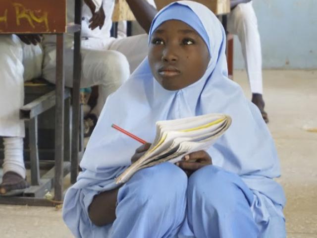 A student attends a class at the Government Day Secondary School Muduru, near Katsina in Nigeria on 3 November 2017. Photo: AFP/Aminu Abubakar