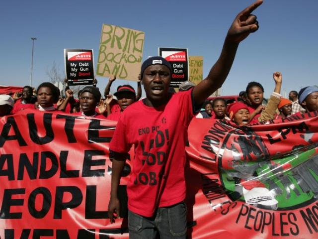 Membes of the Landless Peoples Movement of South Africa march to the National Land Summit in Johannesburg in July 2005 to hand over a memorandum. Land remains a much-debated topic in the country. Photo: AFP/ ALEXANDER JOE
