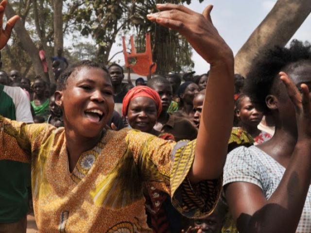 Women celebrate the visit of Central African Republic transitional President Catherine Samba-Panza -the first woman to hold the post of head of state in that country - to a camp for displaced civilians in Bangui in February 2014. Photo: AFP/ ISSOUF S