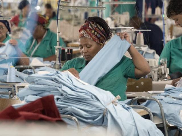 Workers at Kinross Clothing manufacturers in Maitland, Cape Town are pictued in October 2017. South Africa is fighting to revive its frayed clothing industry. Once a crucial provider of jobs in a country suffering from high levels of unemployment, it