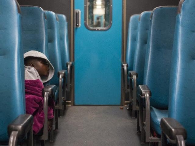 Child sleeping on train
