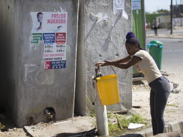 Lady filling water container