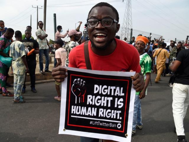 A man protests in Nigeria.