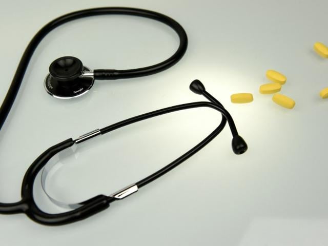 Tablets and a stethoscope displayed for an illustration.