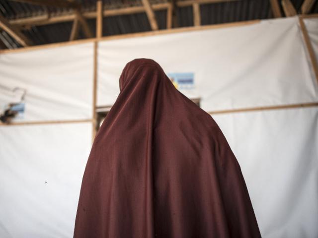 A woman enters one of the consultation rooms at a health clinic in Maiduguri in north-east Nigeria in 2017.