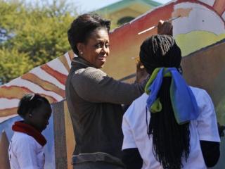 US first lady Michelle Obama helps paint a mural at the Botswana-Baylor Adolescent Center in Gaborone in June 2011. The centre offers support for teenagers with HIV. Photo: AFP/Charles Dharapak